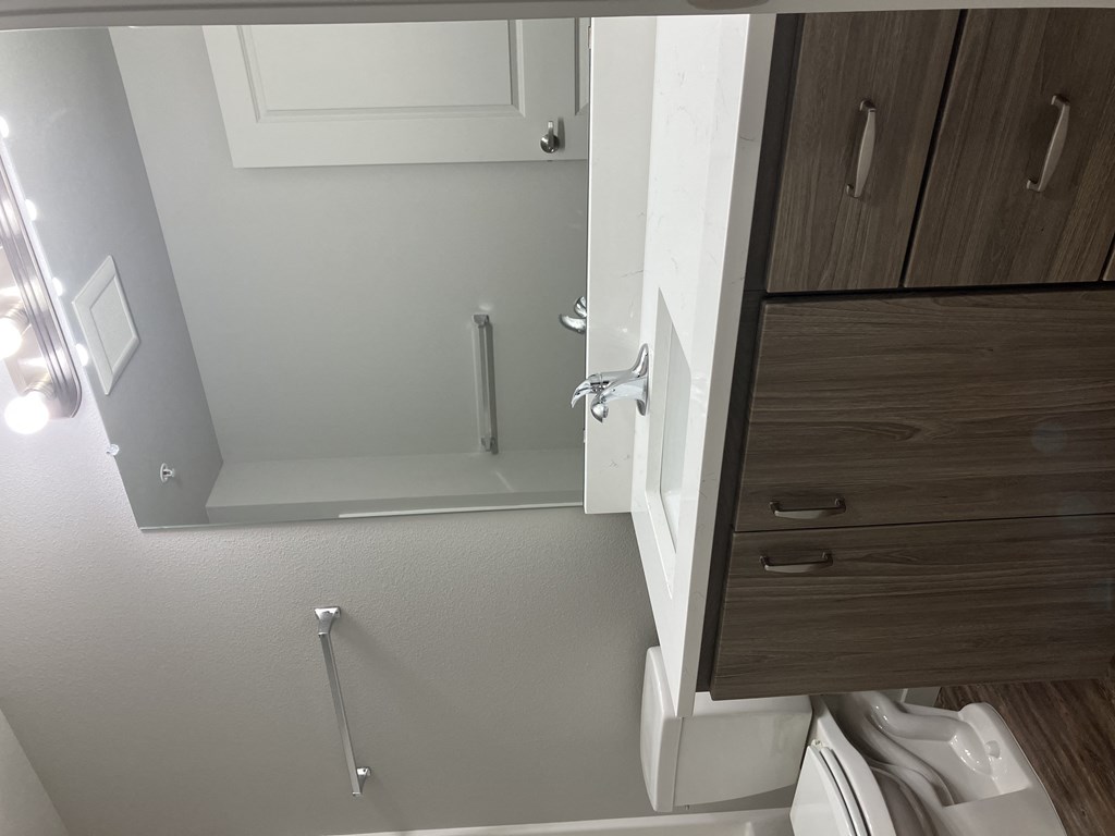 a small bathroom with a toilet and a shower in it