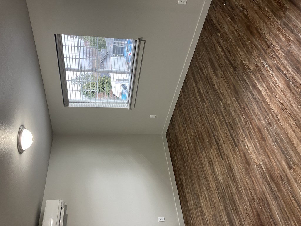 a view of a ceiling and a window in a room