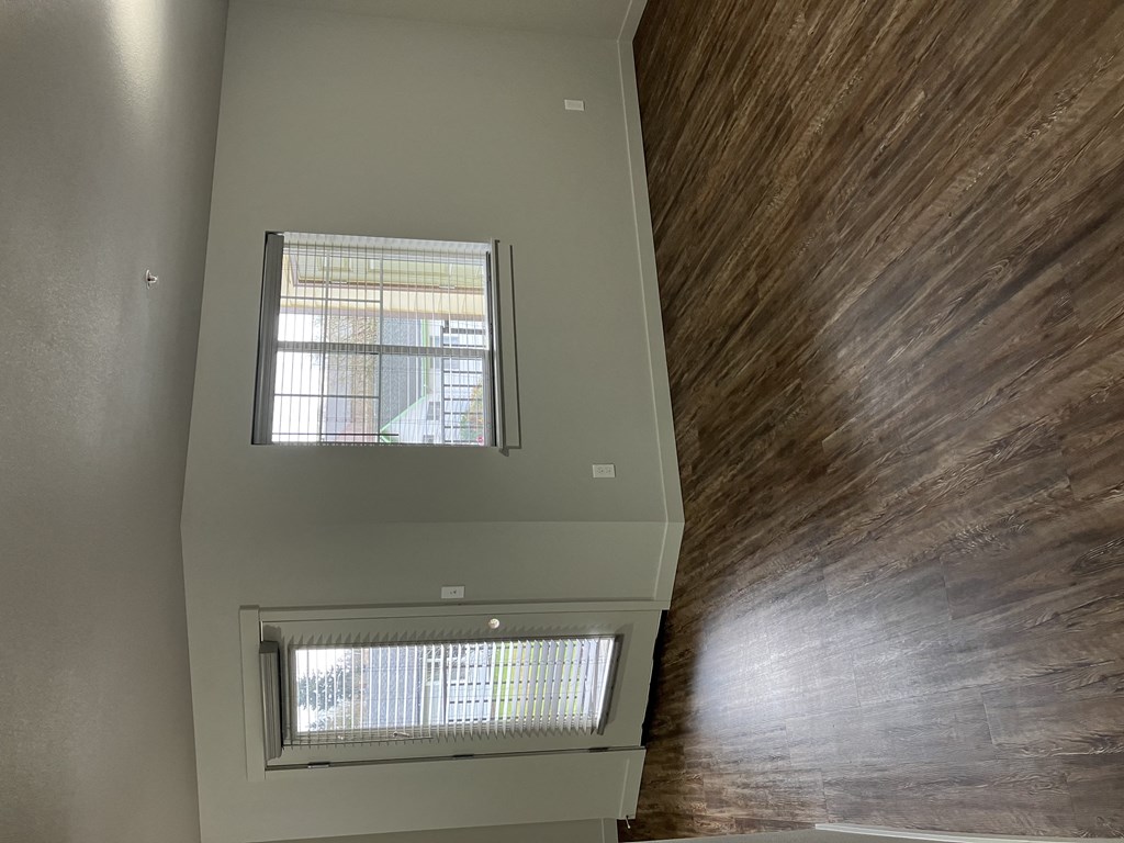 a view of the living room from the top of the stairs looking down into the