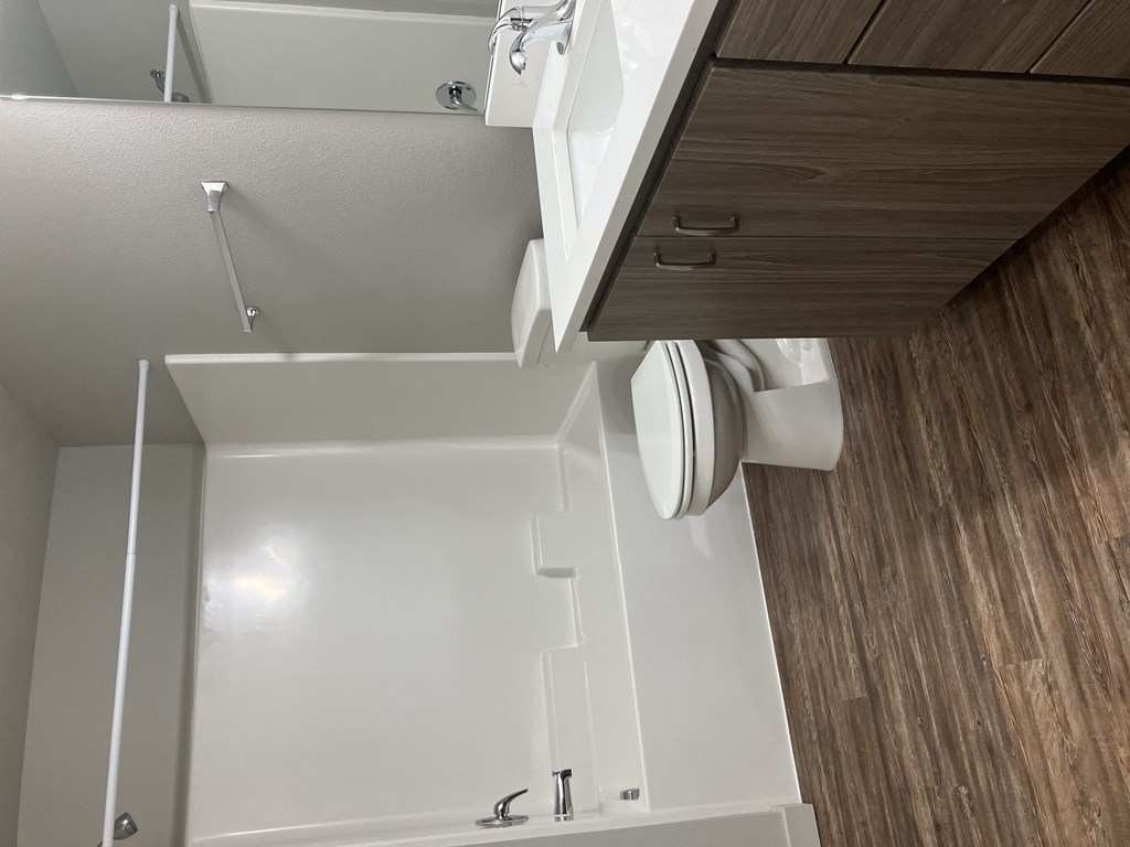 an overhead view of a bathroom with a toilet and a sink