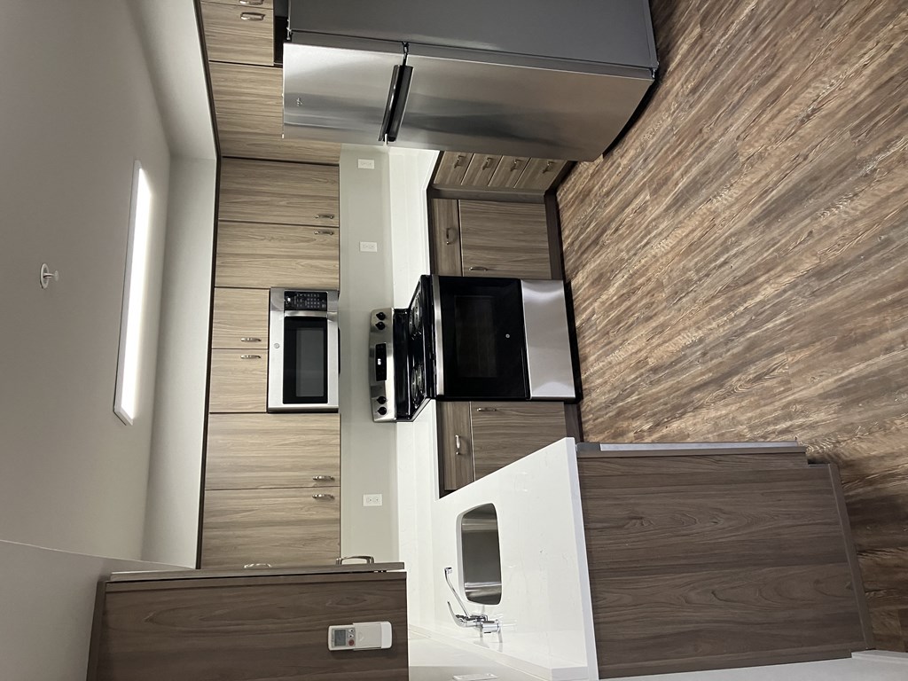 a view of the kitchen from the top of the stairs