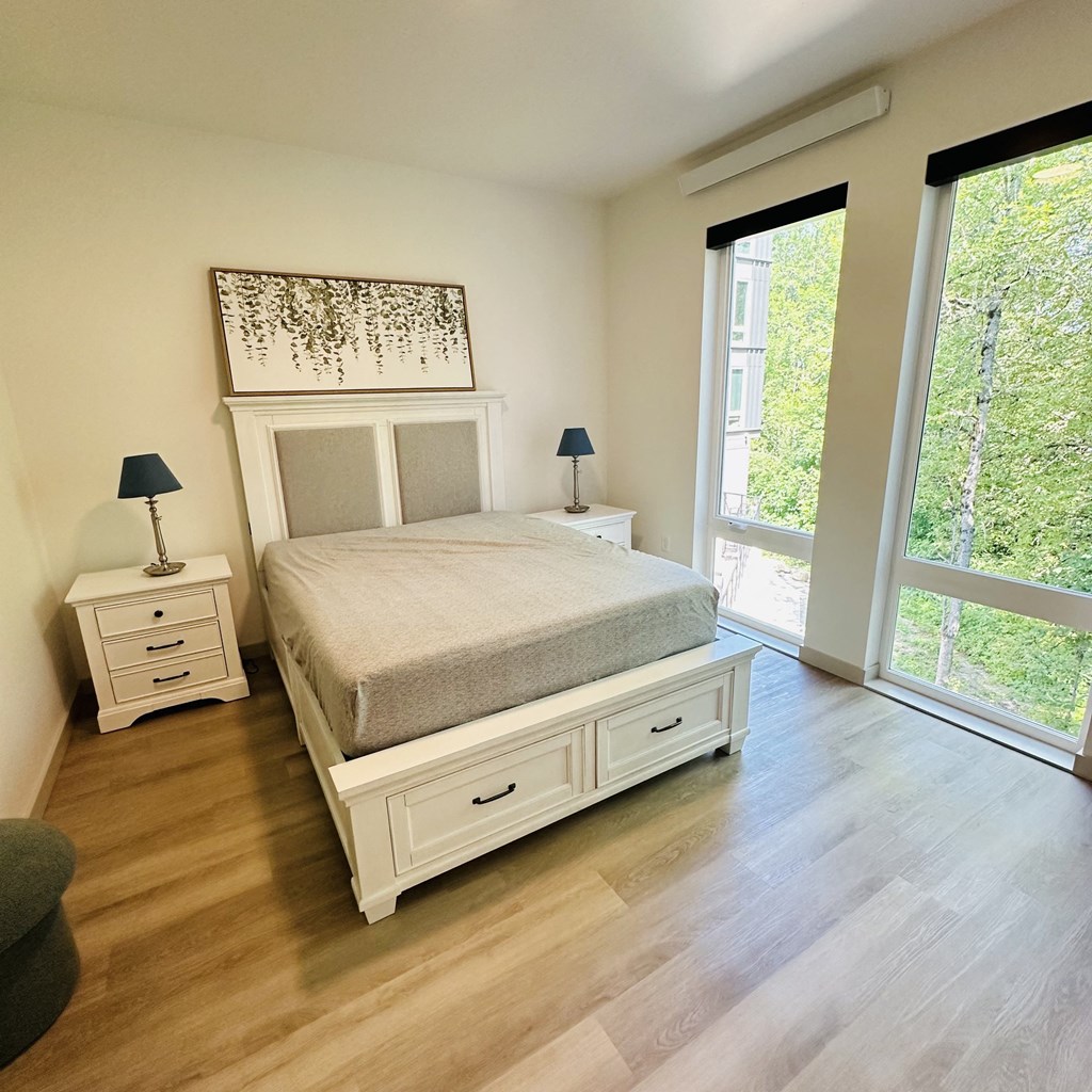 a bedroom with a bed and a window