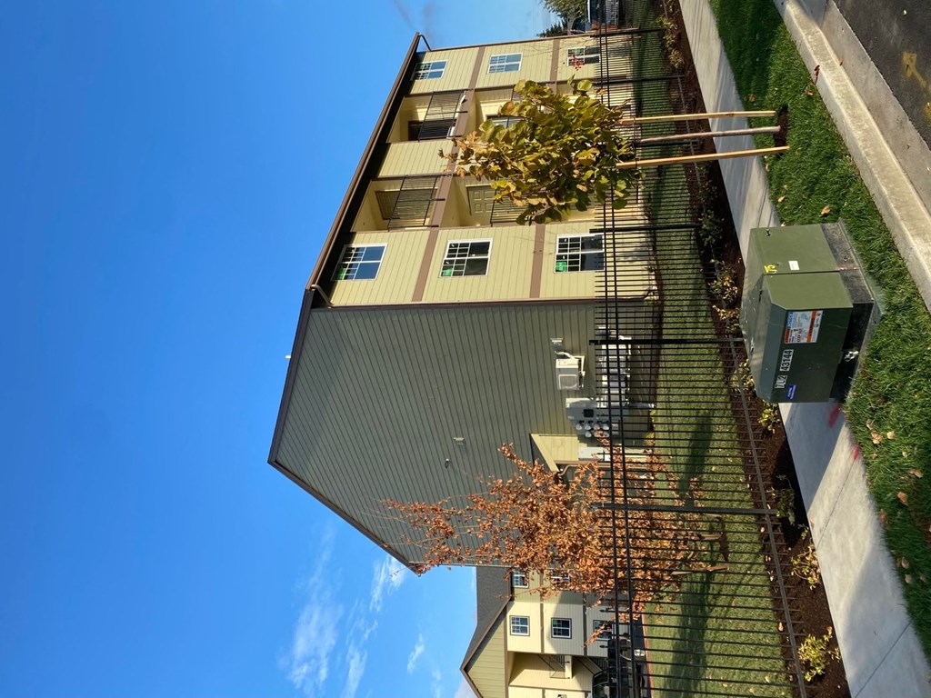 a view of the side of a building from the ground