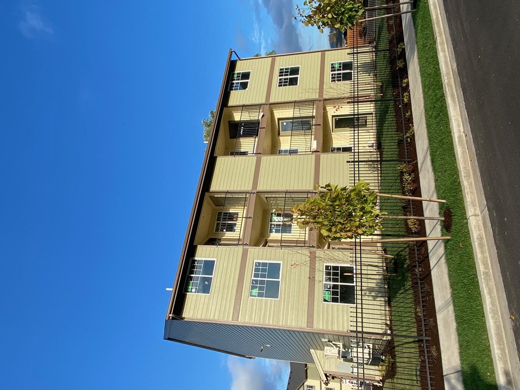 a view of a tall building from the street