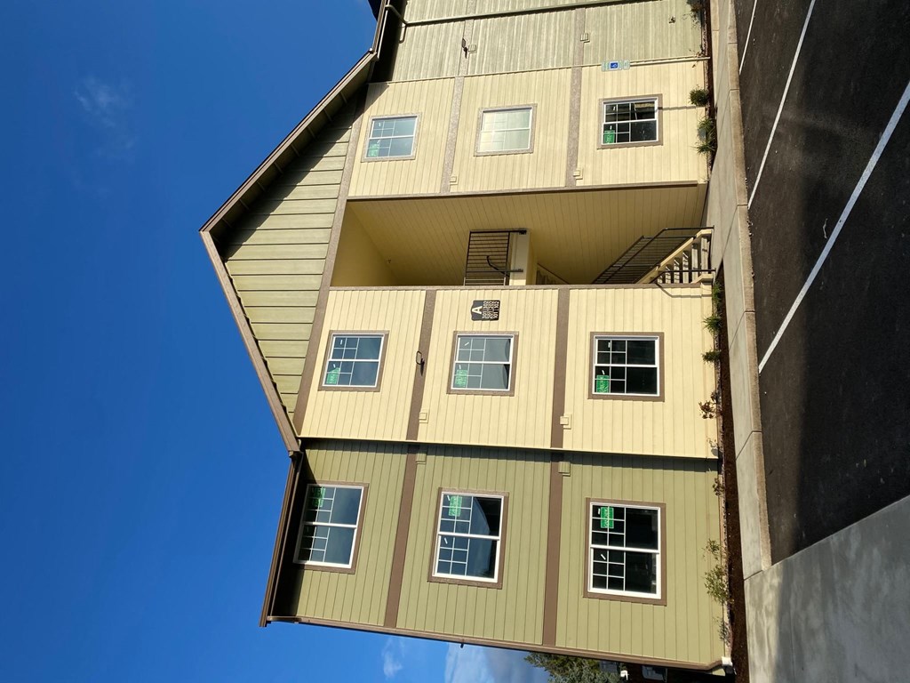 a view of the side of a house from the street