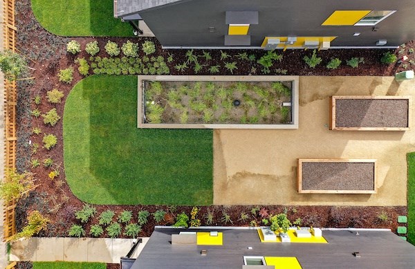 a birds eye view of the garden from the roof of a building