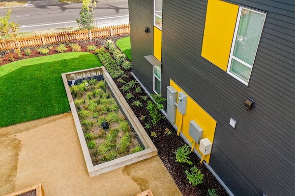 a garden in the front of a house