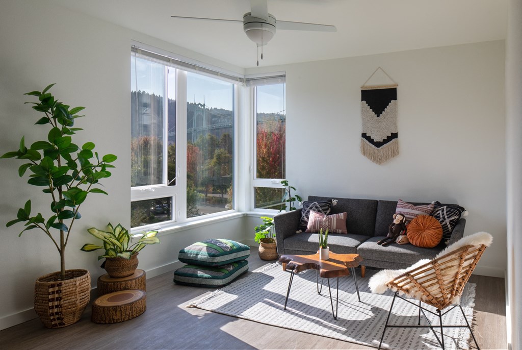 a living room with a couch and a large window