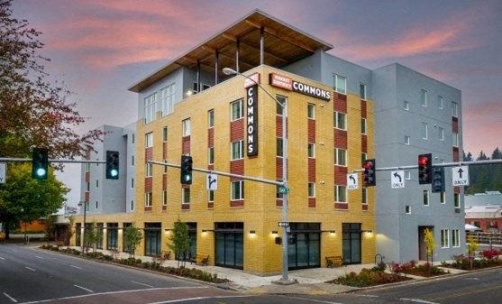 a rendering of a comicon hotel on a street corner