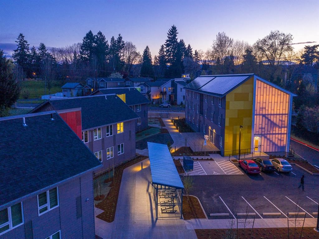 the building is lit up at night in the city