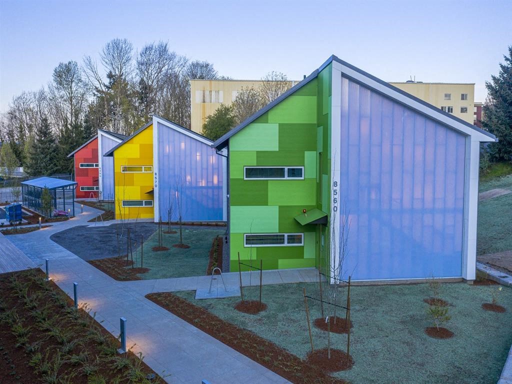 a group of colorful buildings in a courtyard