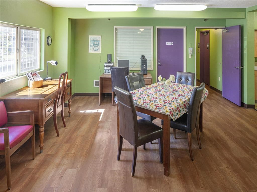 a dining room with a table and chairs
