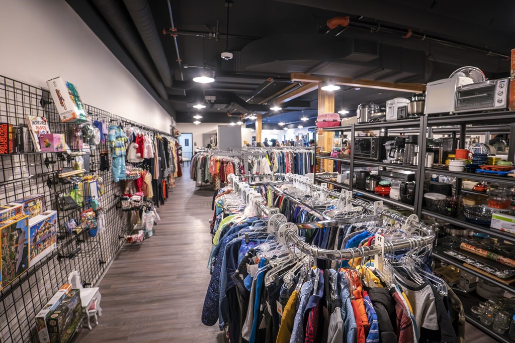 A clothing store with a variety of clothes on display.