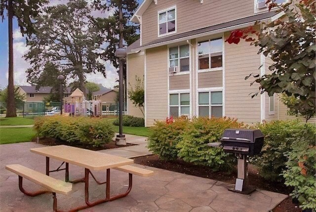a picnic table in front of a house