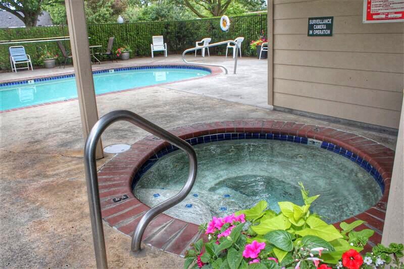a swimming pool and a hot tub in a building