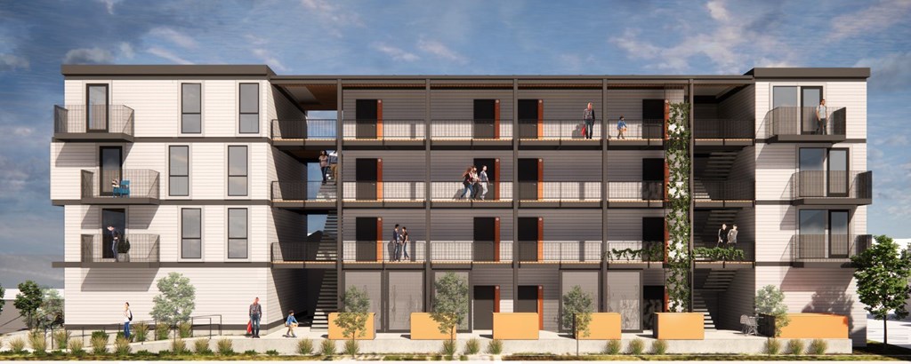 A modern apartment building with balconies and multiple stories.