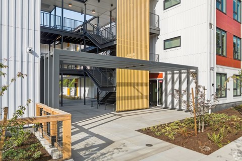 A modern building with a staircase and a ramp.