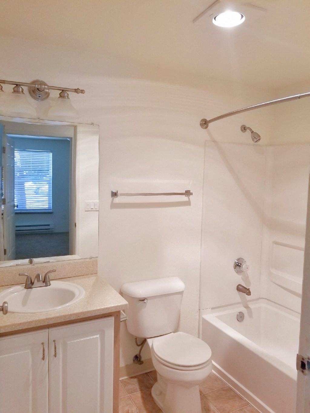 a bathroom with a sink toilet and a bath tub