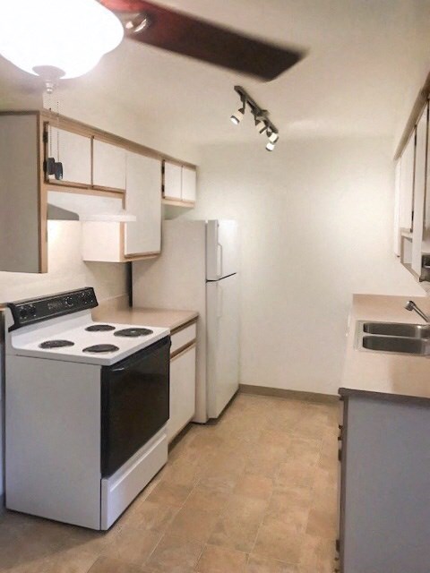 a kitchen with a stove and a refrigerator