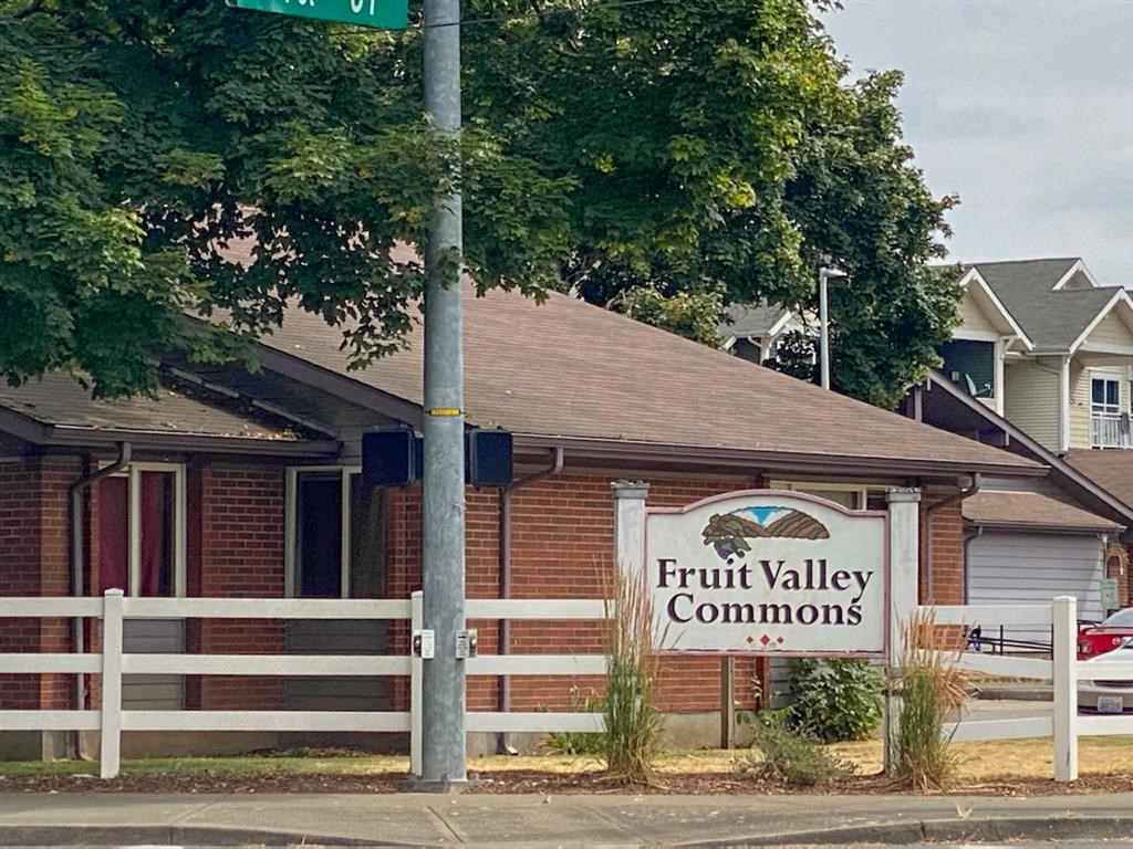 a fruit valley commons sign in front of a building