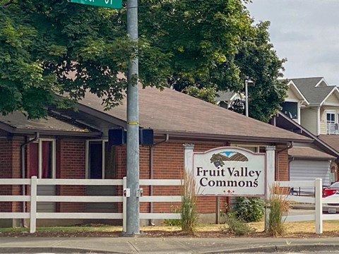 a fruit valley commons sign in front of a building
