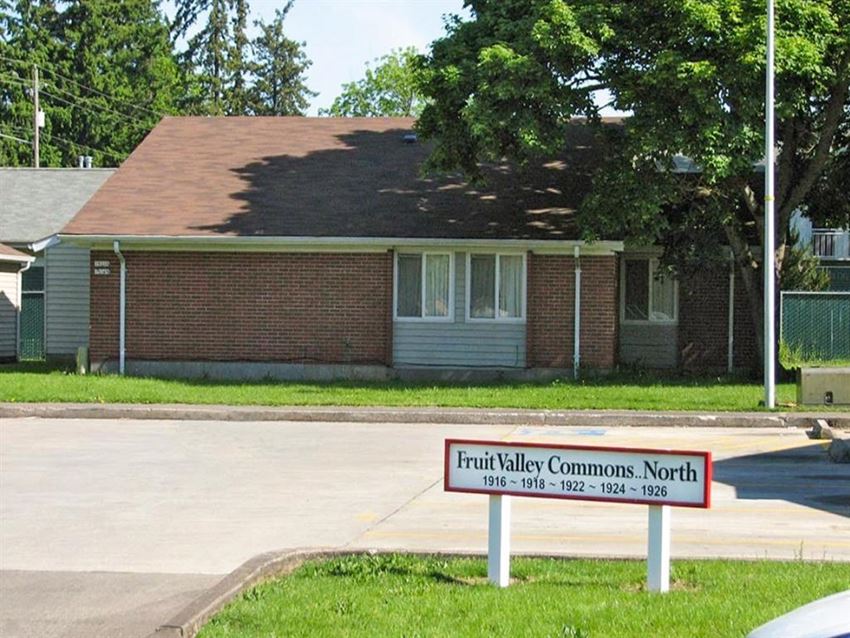 a house with a sign in front of it