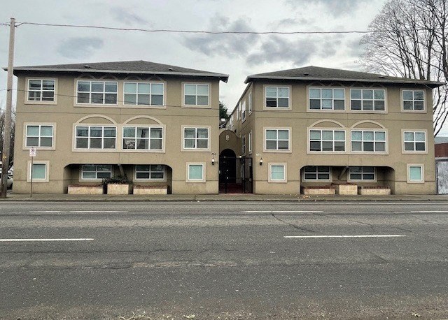 a couple of buildings on the side of a street