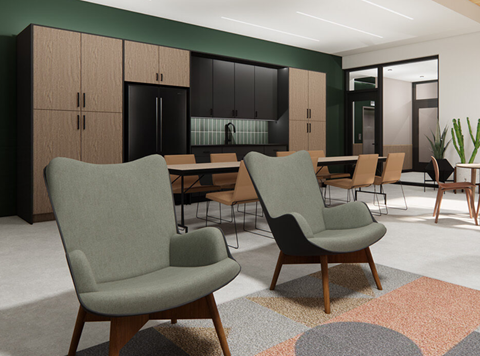 a lounge area with chairs and tables in a room