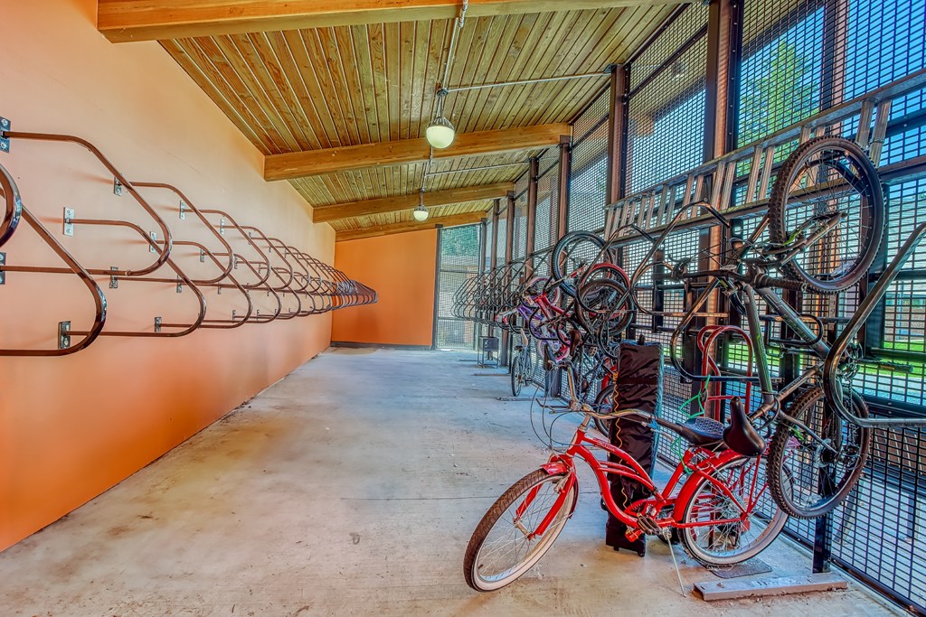 A bike rack with many bikes parked.