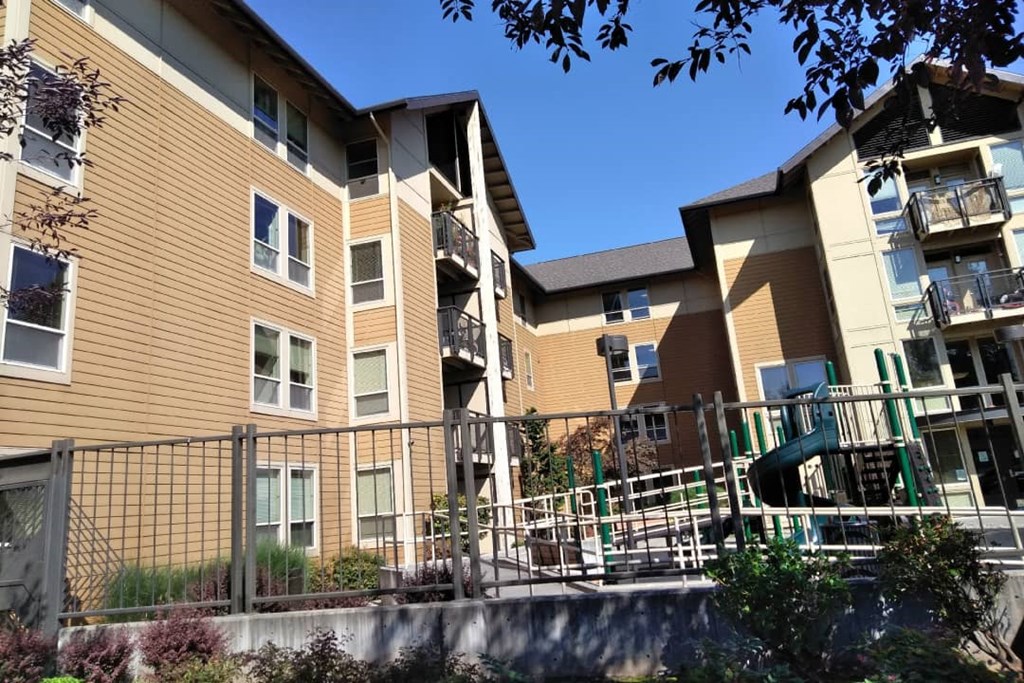 a picture of an apartment complex with a slide
