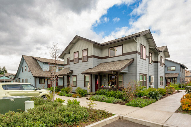 a house with a sidewalk in front of it