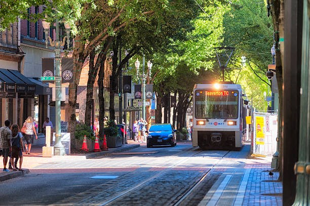 A street scene with a tram on the tracks.