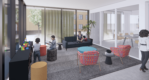 A group of people are sitting in a room with a glass wall and a couch.