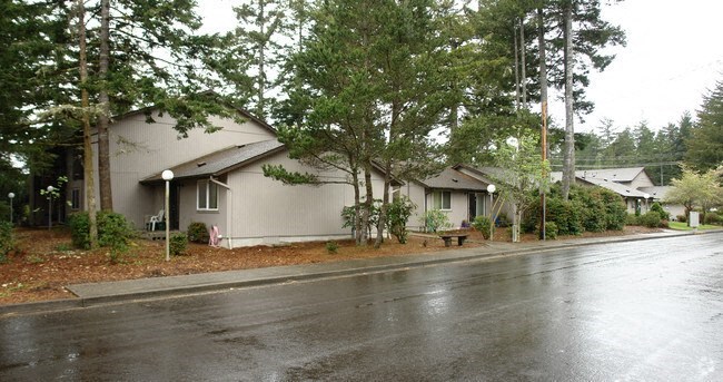 a house with a street in the rain