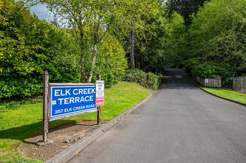 a street with a sign on the side of a road