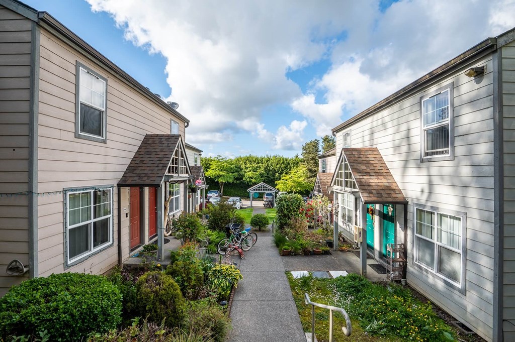 a street of small houses with a path between them