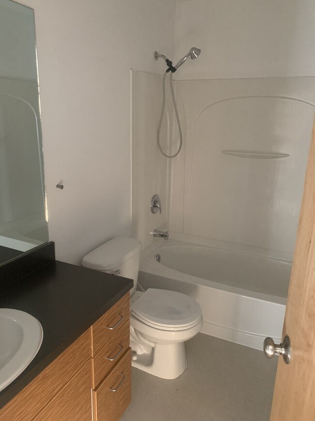 a bathroom with a toilet sink and bathtub