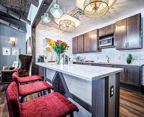 a kitchen with two chairs and a counter top