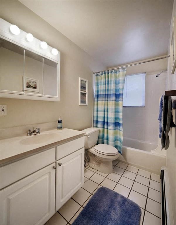 a bathroom with a toilet and a sink and a shower