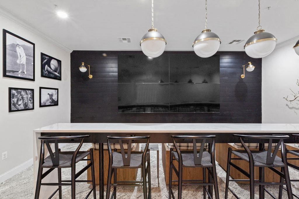 a dining room with a long table and chairs and a fireplace in the background  at Harper's Crossing, Langhorne