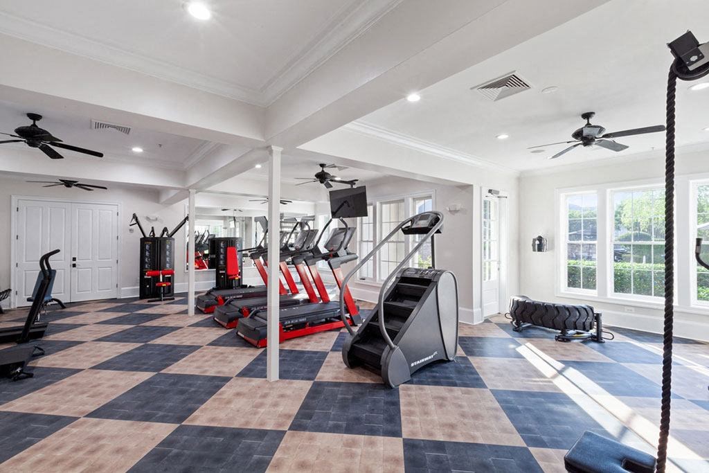 a home gym with a black and white checkered floor  at Harper's Crossing, Langhorne, PA