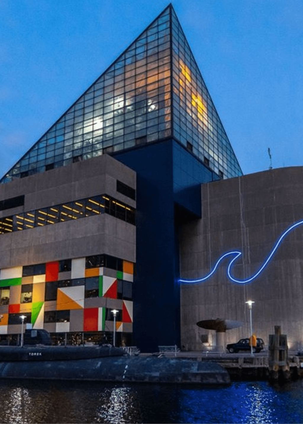 a building on the side of a body of water