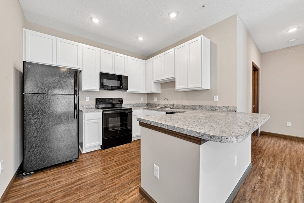 a kitchen with a counter top and a refrigerator