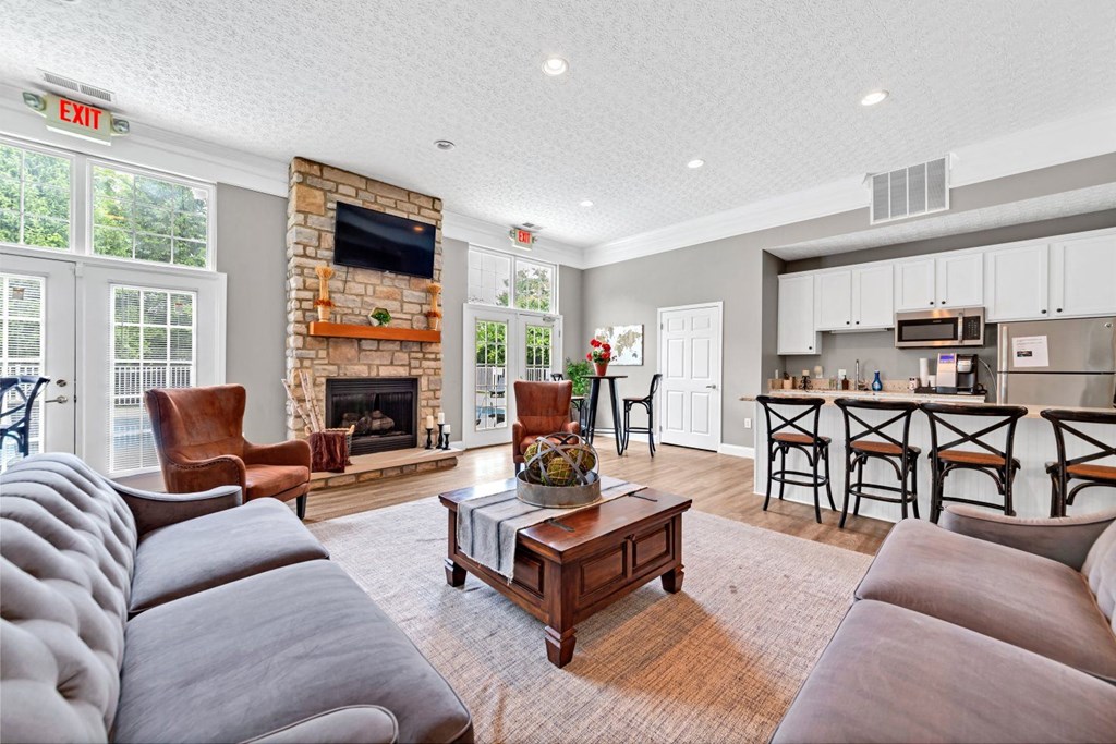 a living room with a couch and a fireplace