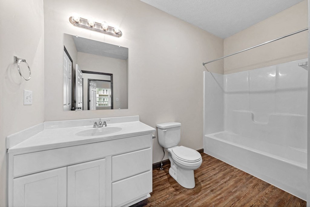 a bathroom with a sink toilet and a shower