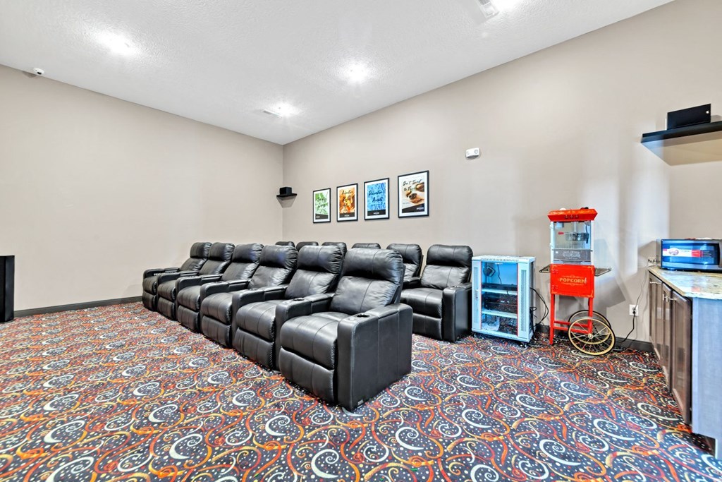 the preserve at ballantyne commons community theater room with couches