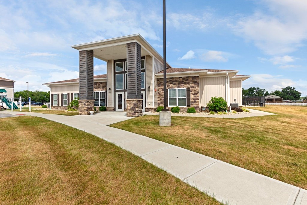 a house with a sidewalk in front of it
