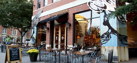 A restaurant named Le Panouffrient has tables and chairs outside.