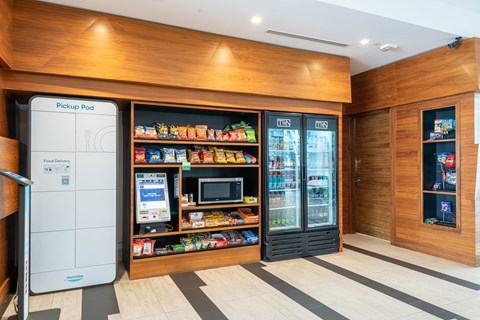 A modern kitchen with a white fridge and a wooden counter top.