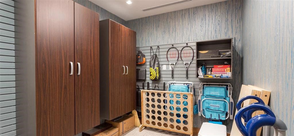 a gym room with a rack of gym equipment in it